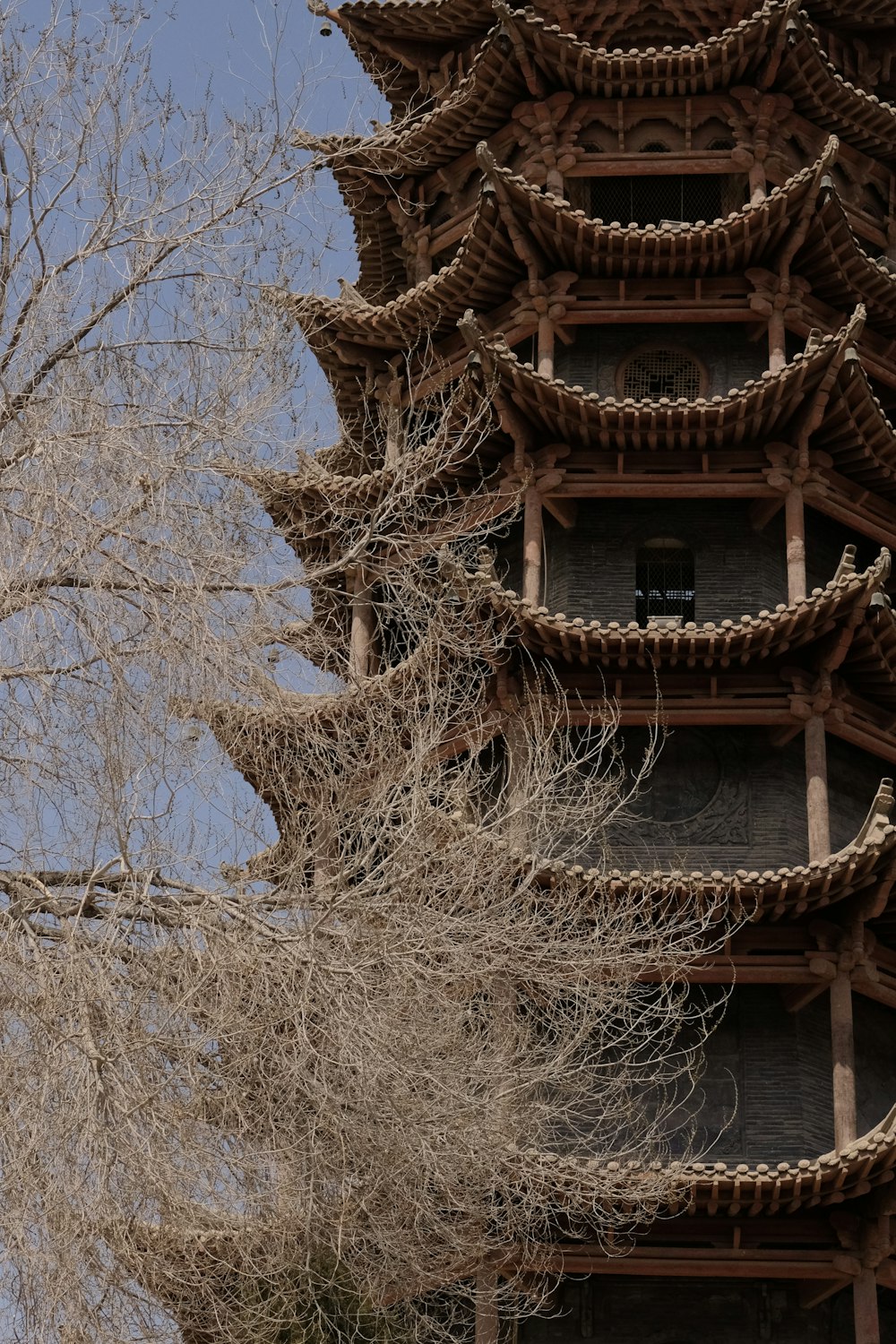 a tall tower with a clock on the top of it