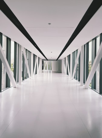 a long hallway with black and white striped walls