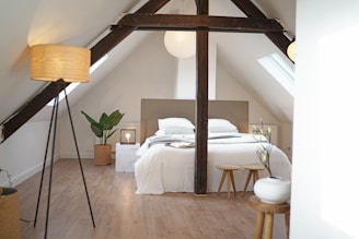 Before and after shots of a loft transformation turning an unused attic into a modern bedroom.