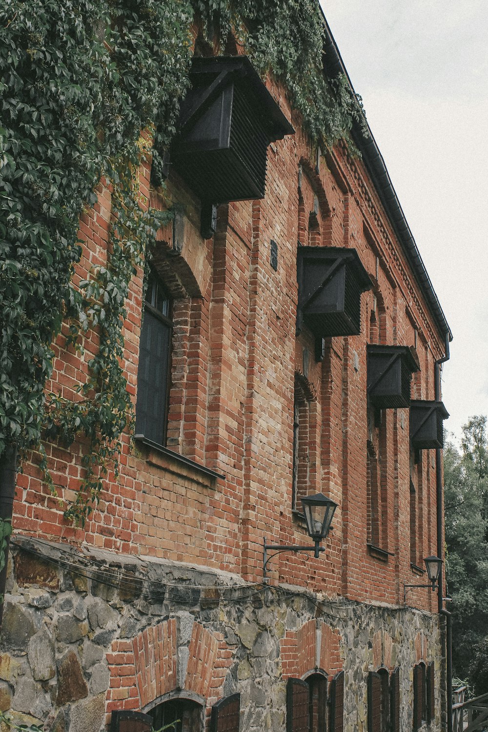 a brick building with a clock on the side of it