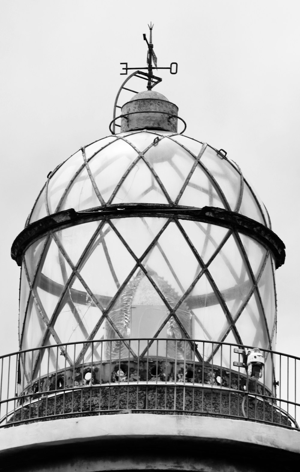 a black and white photo of a lighthouse