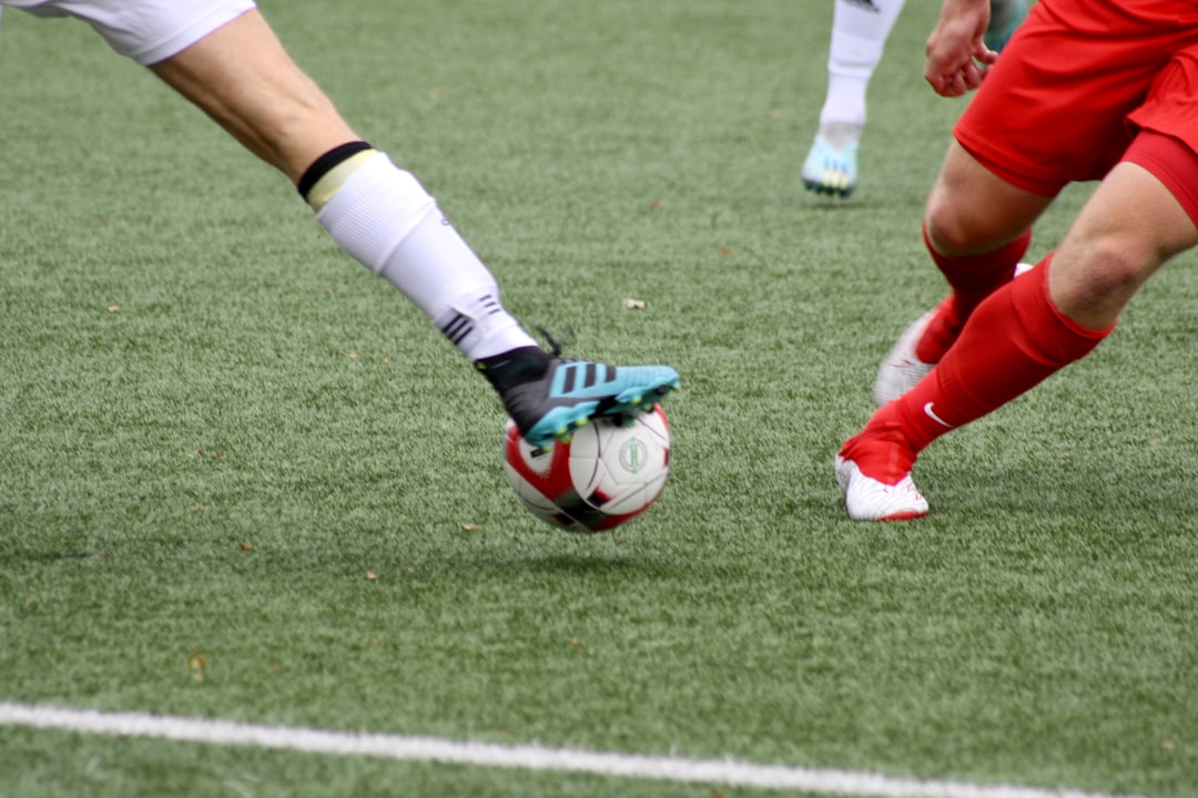 a couple of men playing a game of soccer