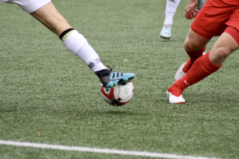 a couple of men playing a game of soccer