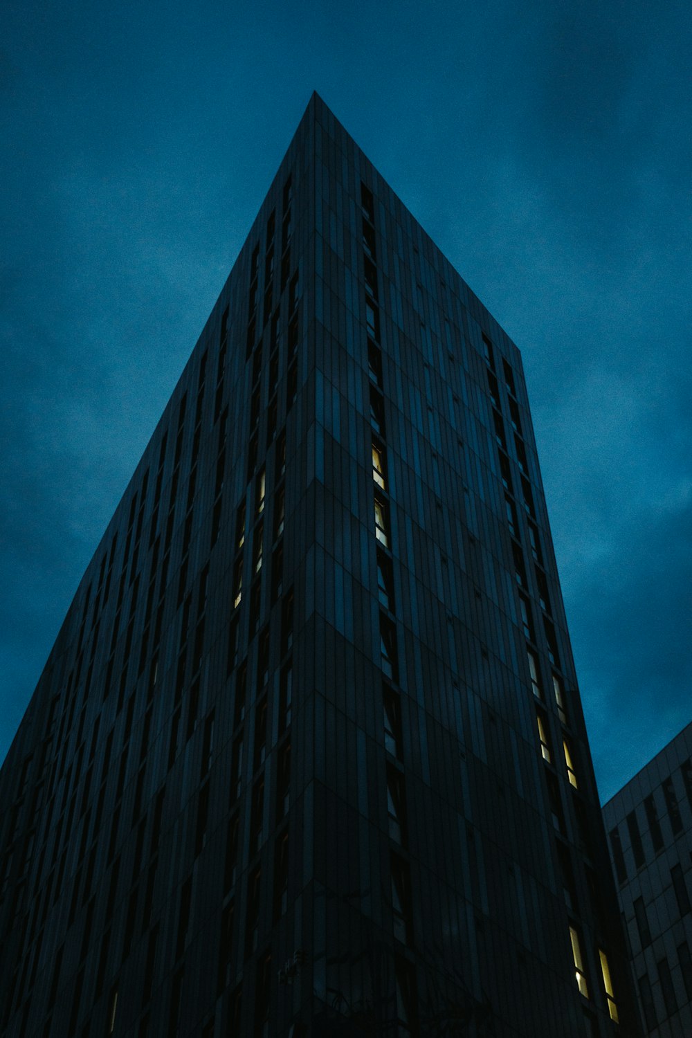 a very tall building lit up at night