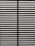 Horizontal blinds partially open with light filtering through the slats, casting striped shadows and creating a geometric pattern.