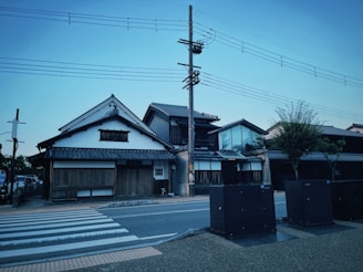 A skilled electrician installing traditional-style lighting fixtures in a modern Japanese home.