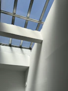 Interior view of a minimalist loft with exposed brick and natural light.