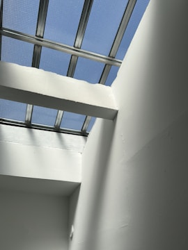 Daylight rendering of a minimalist commercial office space with natural light.