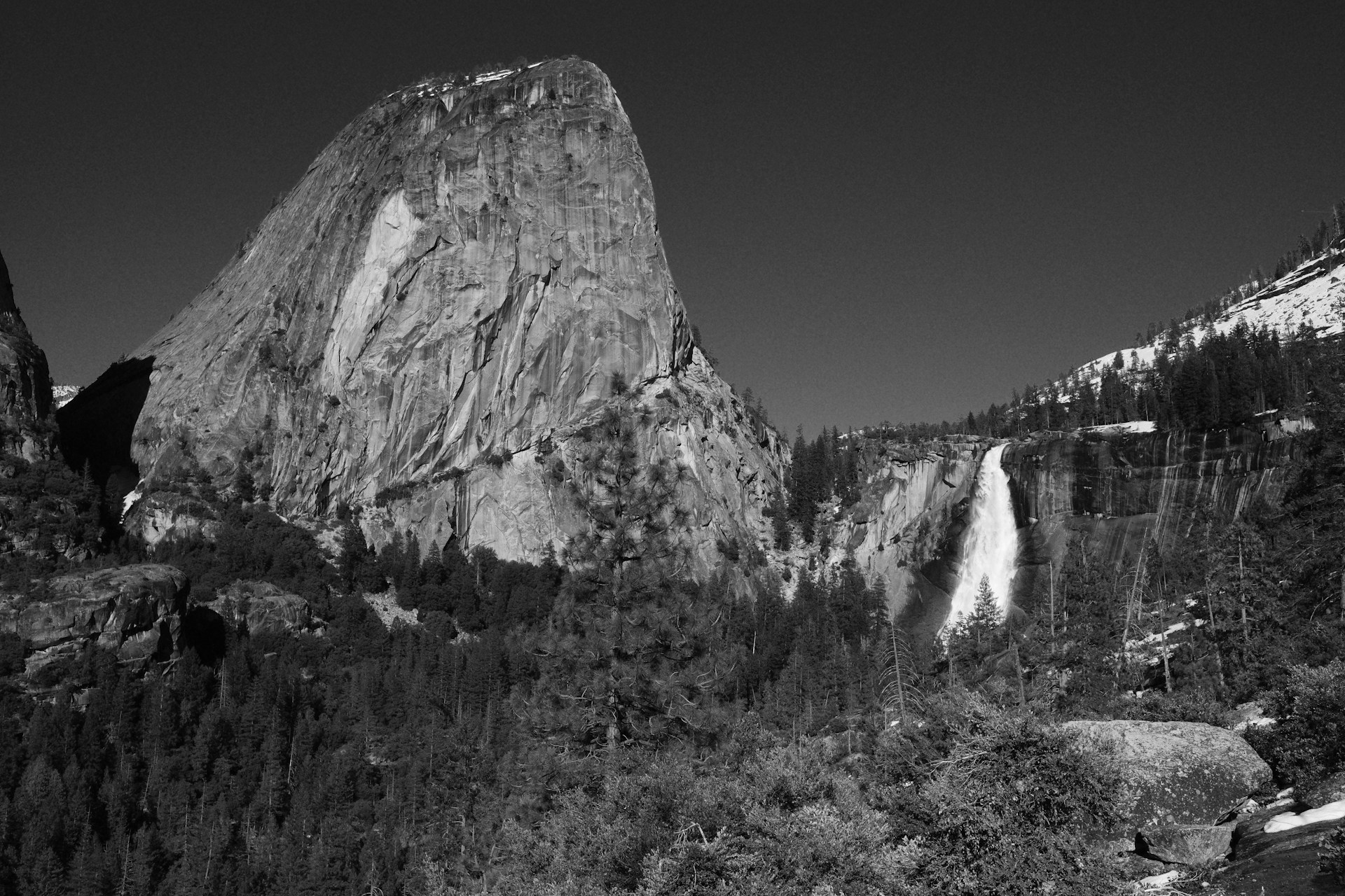 a black and white photo of a waterfall