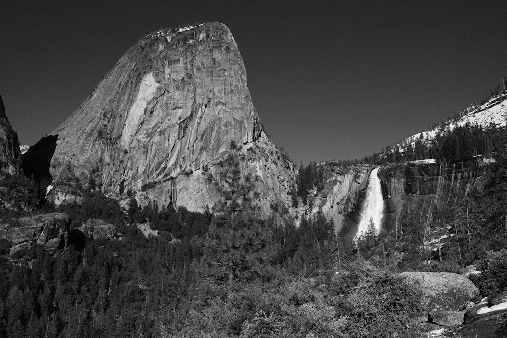 a black and white photo of a waterfall