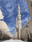 a large white building with a tall tower