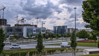 A scenic view of Bordeaux city with construction cranes in the background symbolizing ongoing projects.