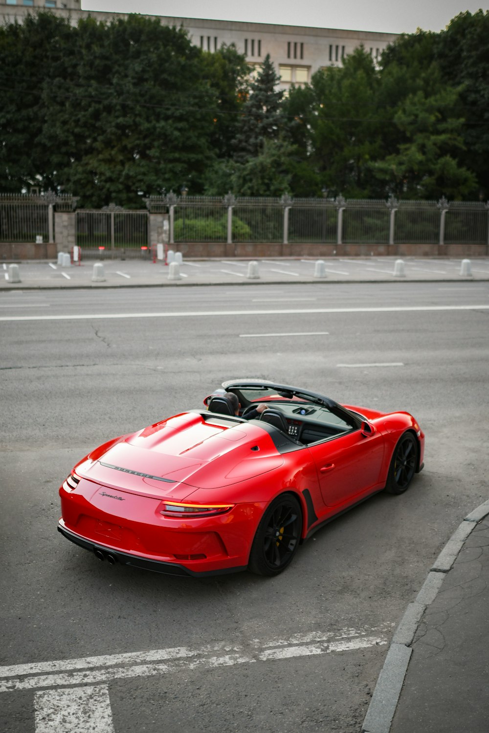 a red sports car parked in a parking lot