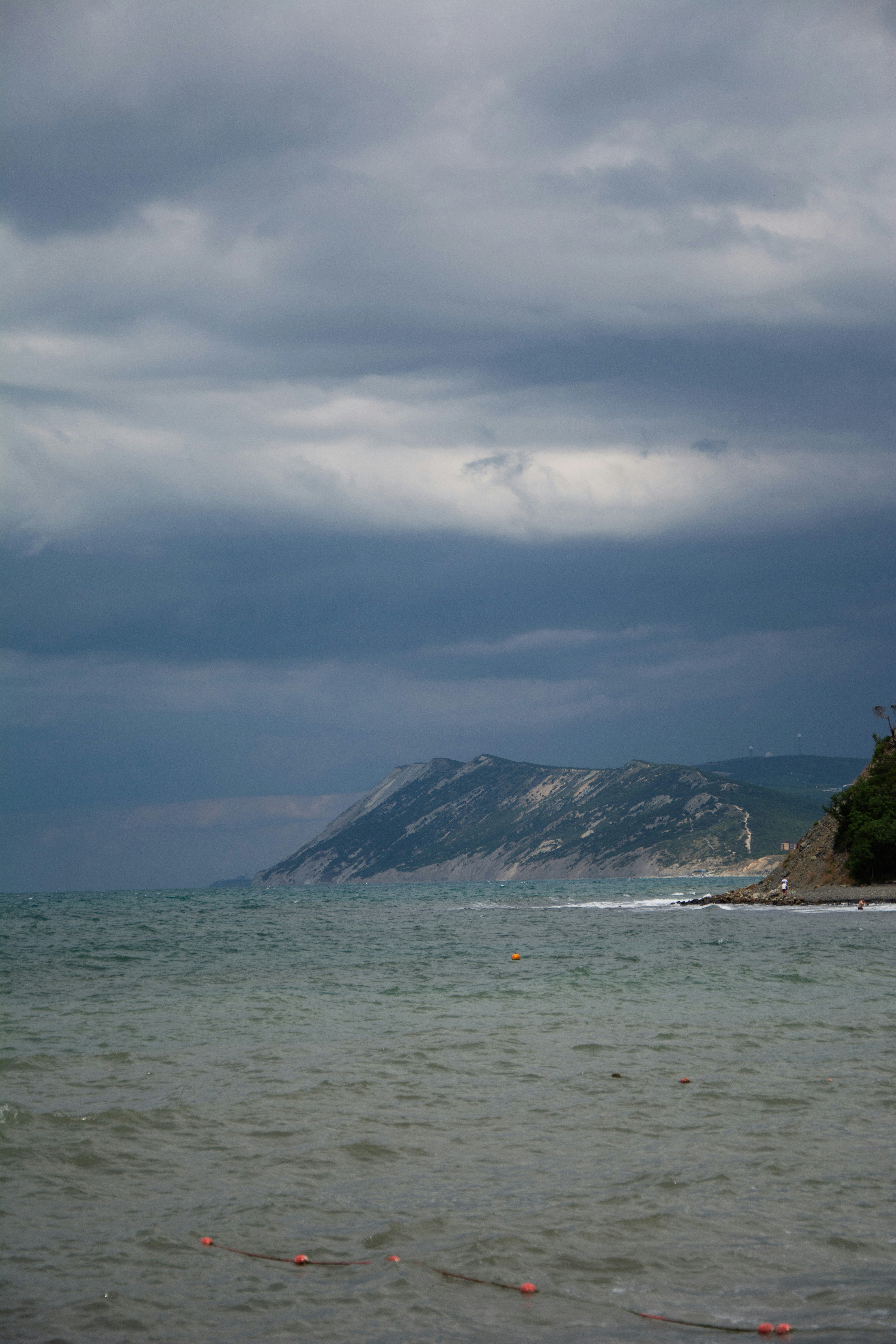 a large body of water under a cloudy sky