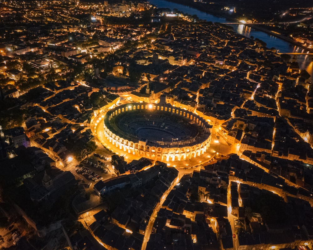 an aerial view of a stadium lit up at night