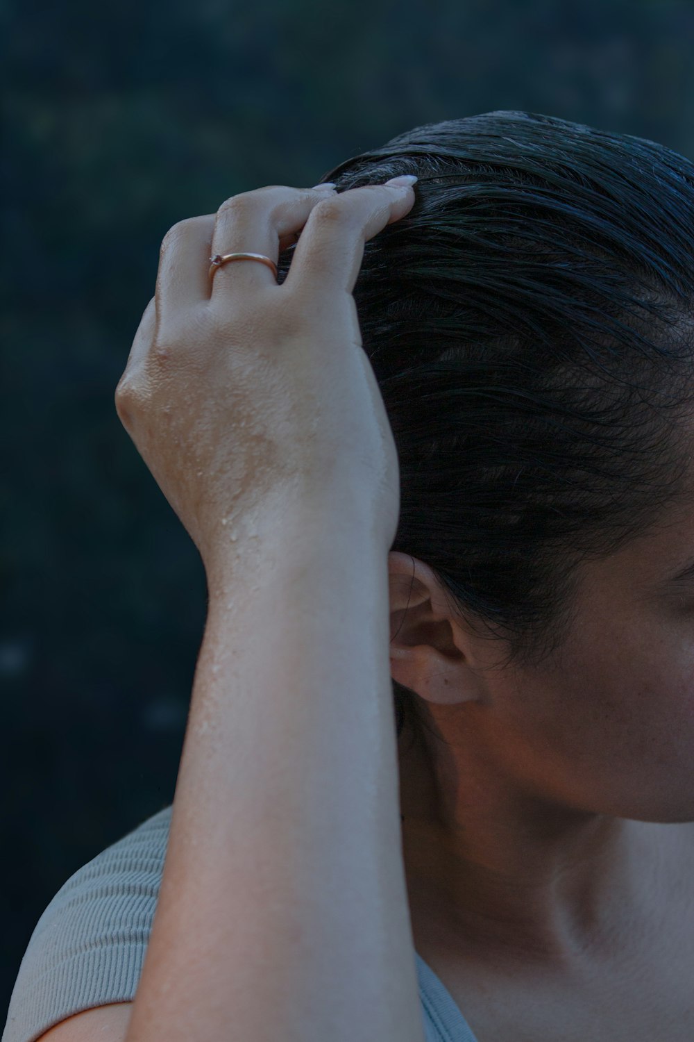 a woman holding her hair in the wind