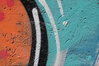 Close-up of vibrant graffiti artwork on an urban wall.