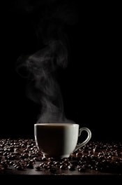 A steaming cup of coffee surrounded by nature.