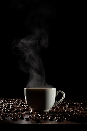 A warm, inviting coffee cup surrounded by coffee beans from Colombia, Ethiopia, and Yemen.