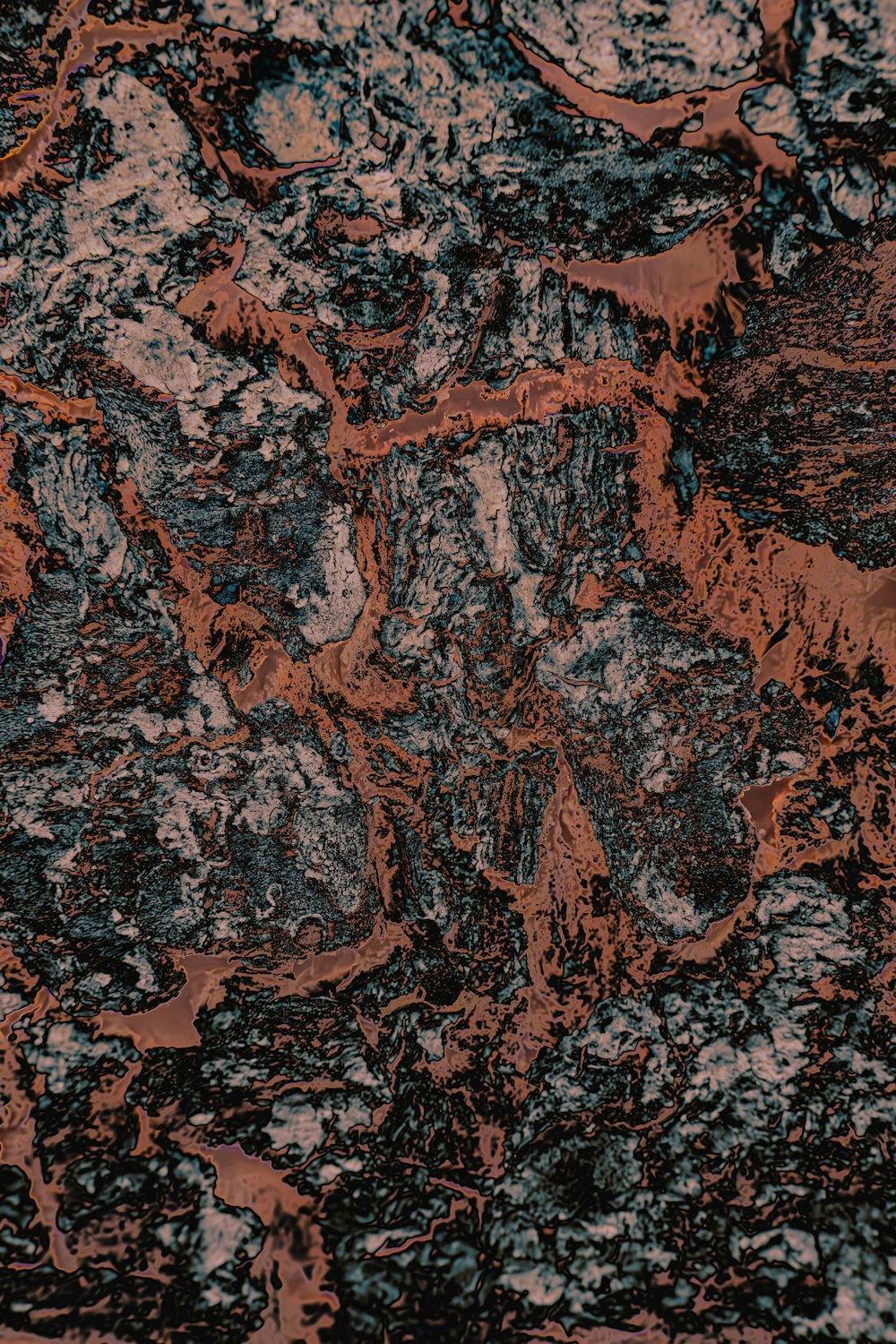 a close up of a red and black marble