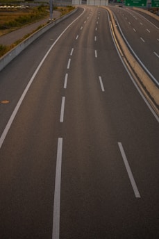 A newly constructed road with clear markings and signage.