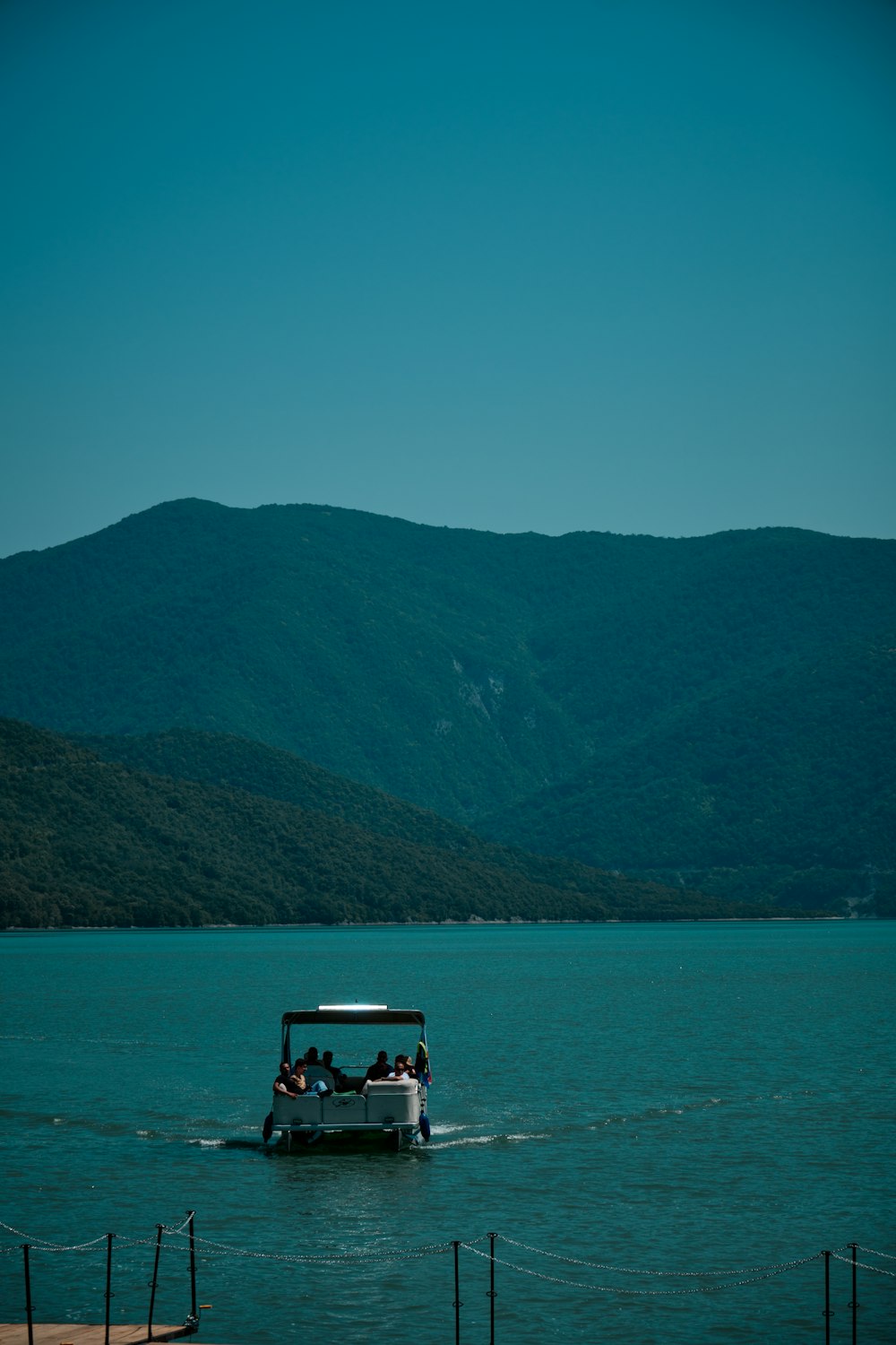 a group of people on a boat in the water