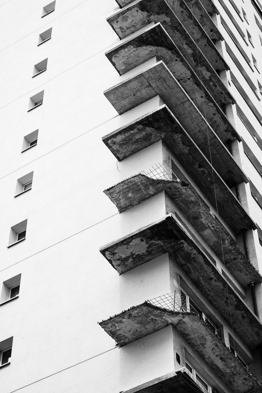 a black and white photo of a tall building