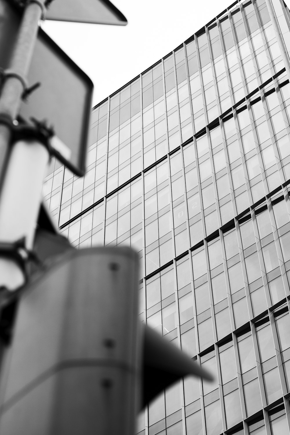 a traffic light sitting next to a tall building