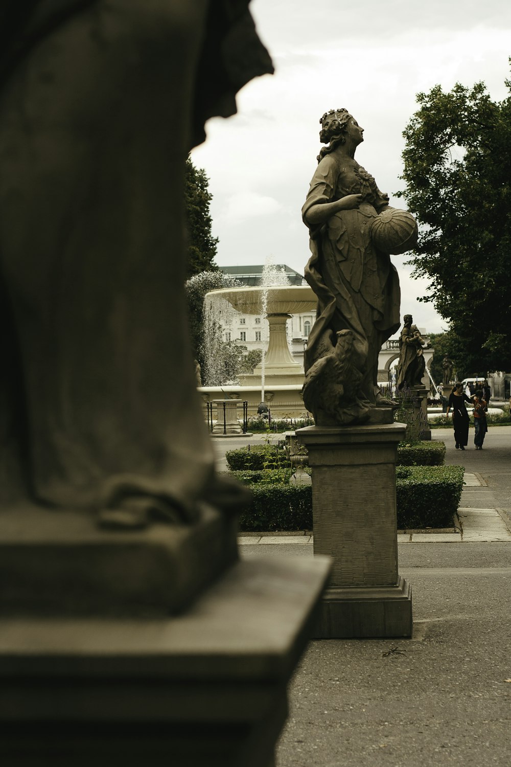 a statue of a man holding a bird in his hand