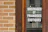 A sparkling clean storefront window reflecting a sunny street in Gaillon.