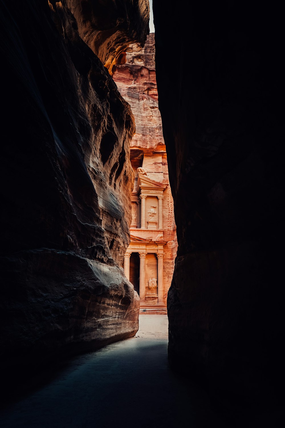 a narrow narrow passage between two large rocks