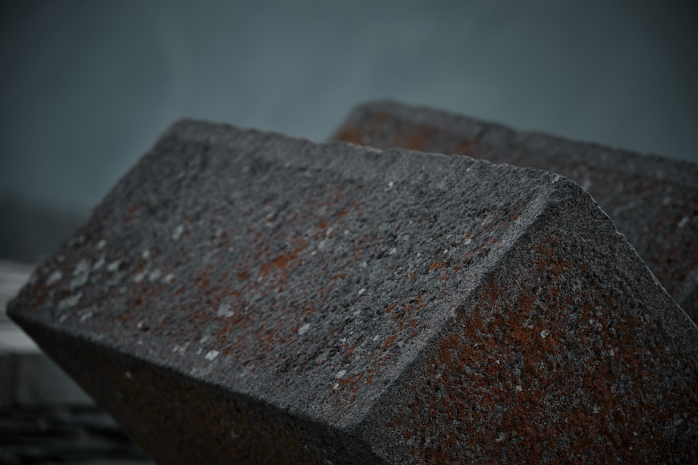 a close up of a stone block with a blurry background