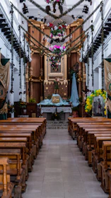 Volunteers decorating the church for a special event, their smiles reflecting love and dedication.