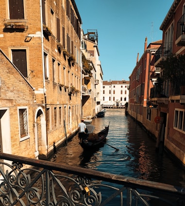 A warm photo of the ia venezia team collaborating in a cozy Venetian office, with views of canals in the background.