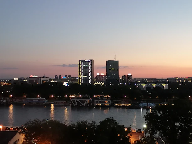 A realistic Riyadh city skyline at dusk with soft modern lighting and a calm atmosphere.