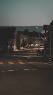 A quiet street scene at dusk, with soft focus and minimalist composition.