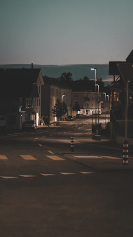 A quiet street scene at dusk, with soft focus and minimalist composition.