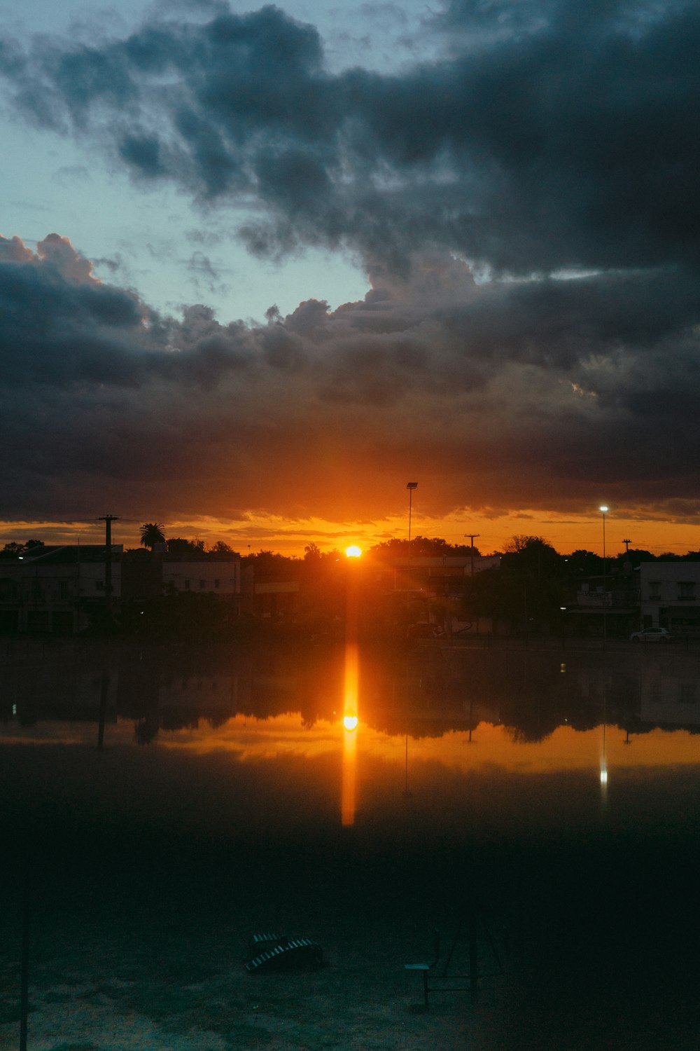 the sun is setting over a body of water