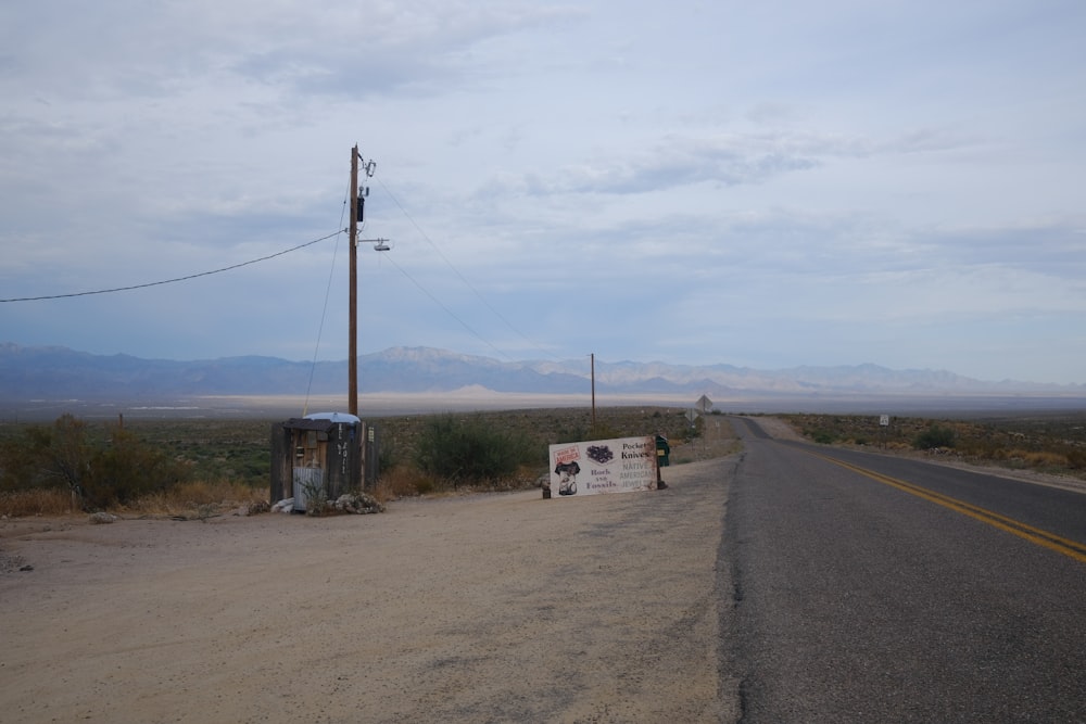 a road with a sign on the side of it