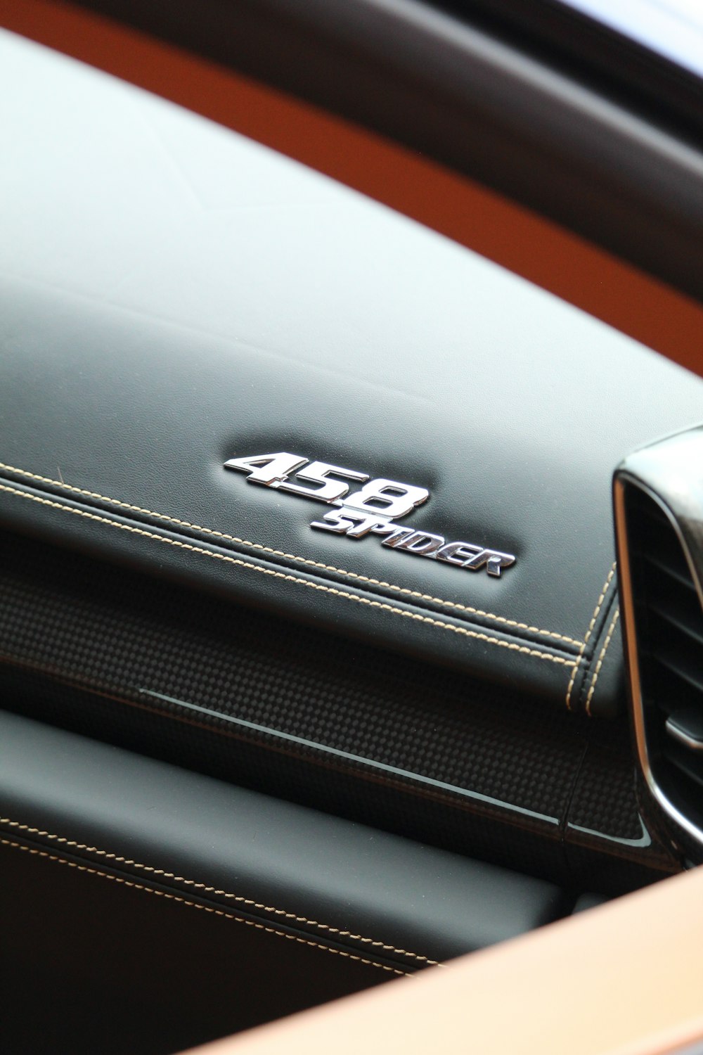 a close up of a car's emblem on the dashboard