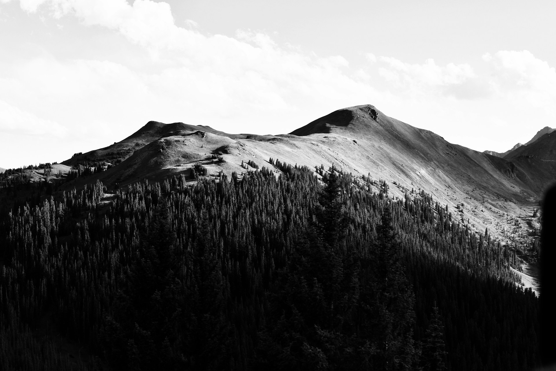 a black and white photo of a mountain range