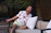 A happy customer wearing a sleek lounge set from sassy street wear, smiling outdoors.