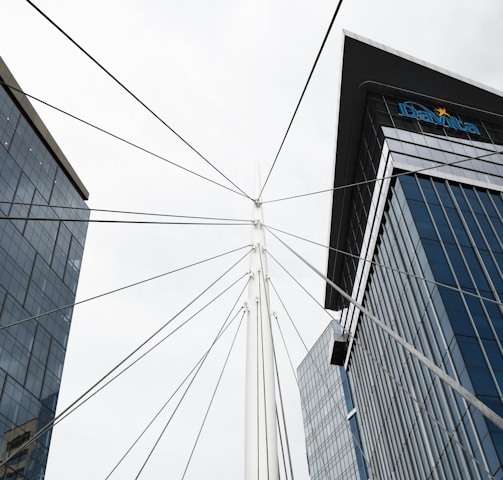 a view of two tall buildings from the ground