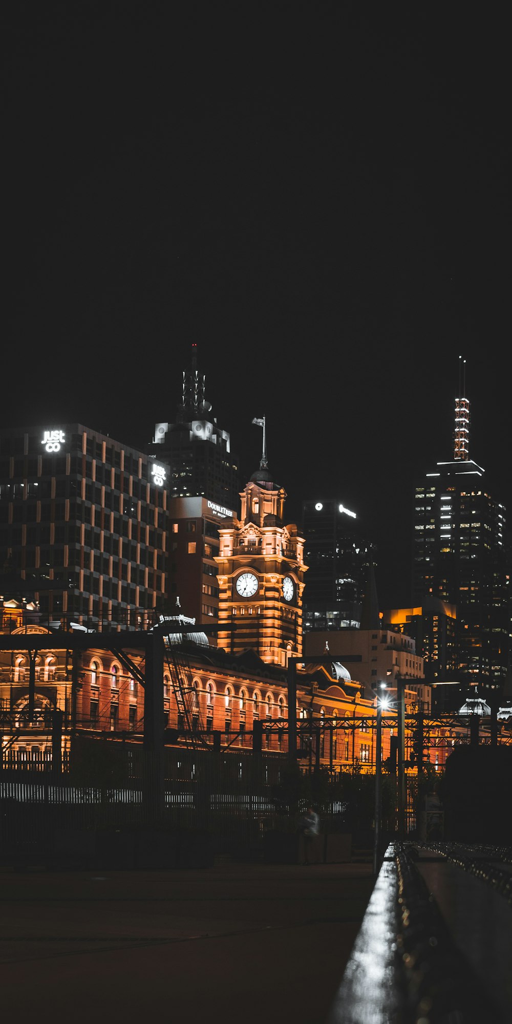 a large building lit up at night in the city