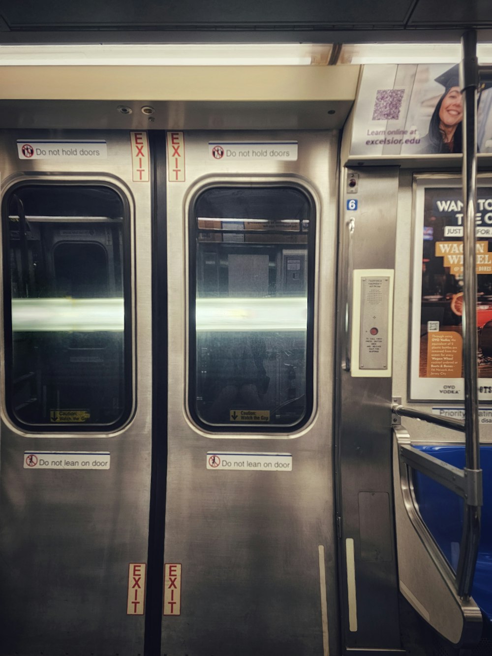 a silver subway car with its doors open