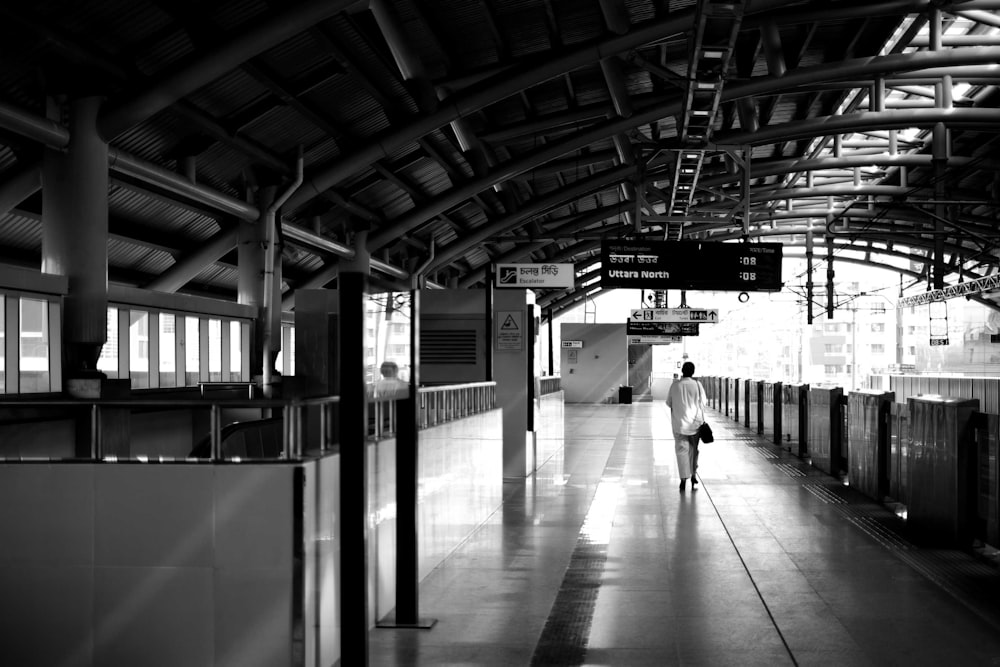 a black and white photo of a train station