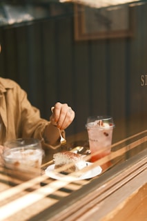 a man sitting at a table with a plate of food