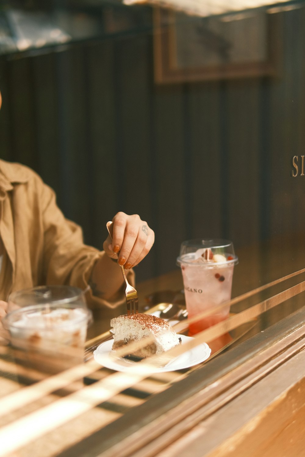 a man sitting at a table with a plate of food