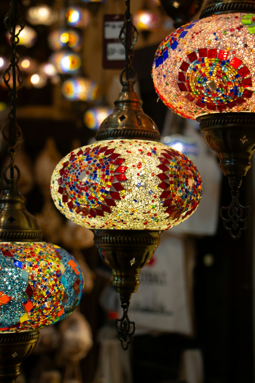 a group of colorful lights hanging from a ceiling