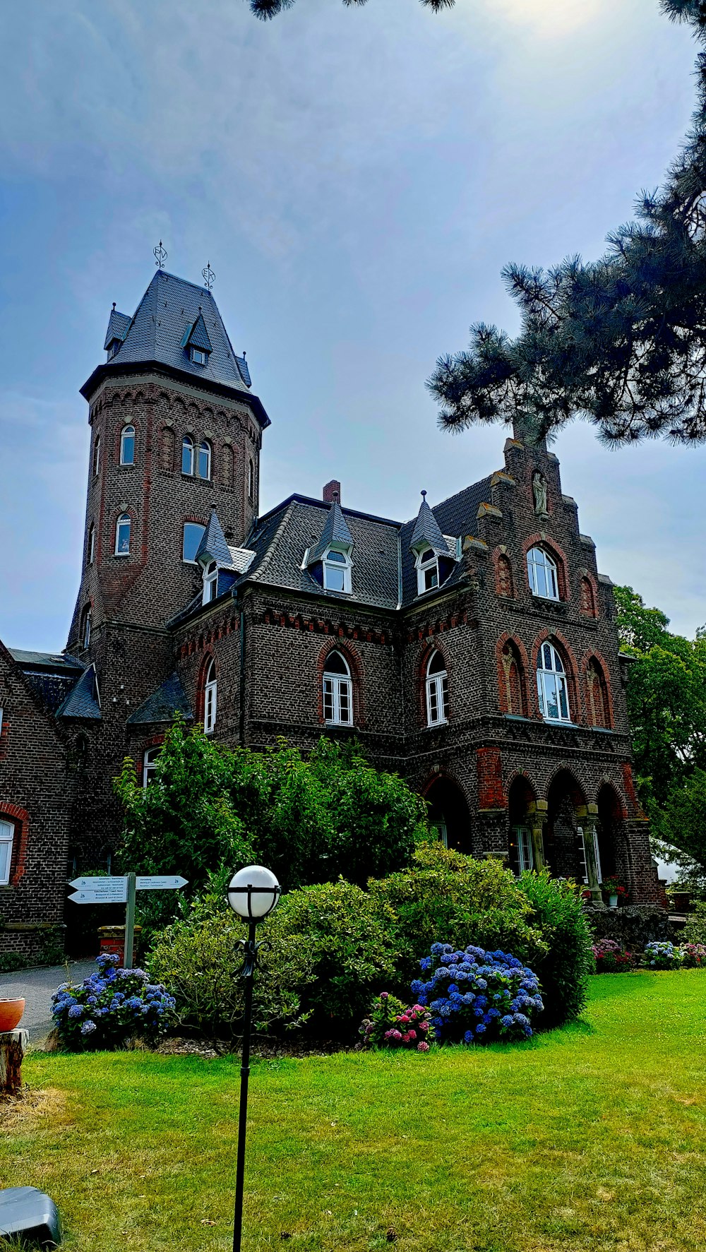 a large brick building with a clock tower